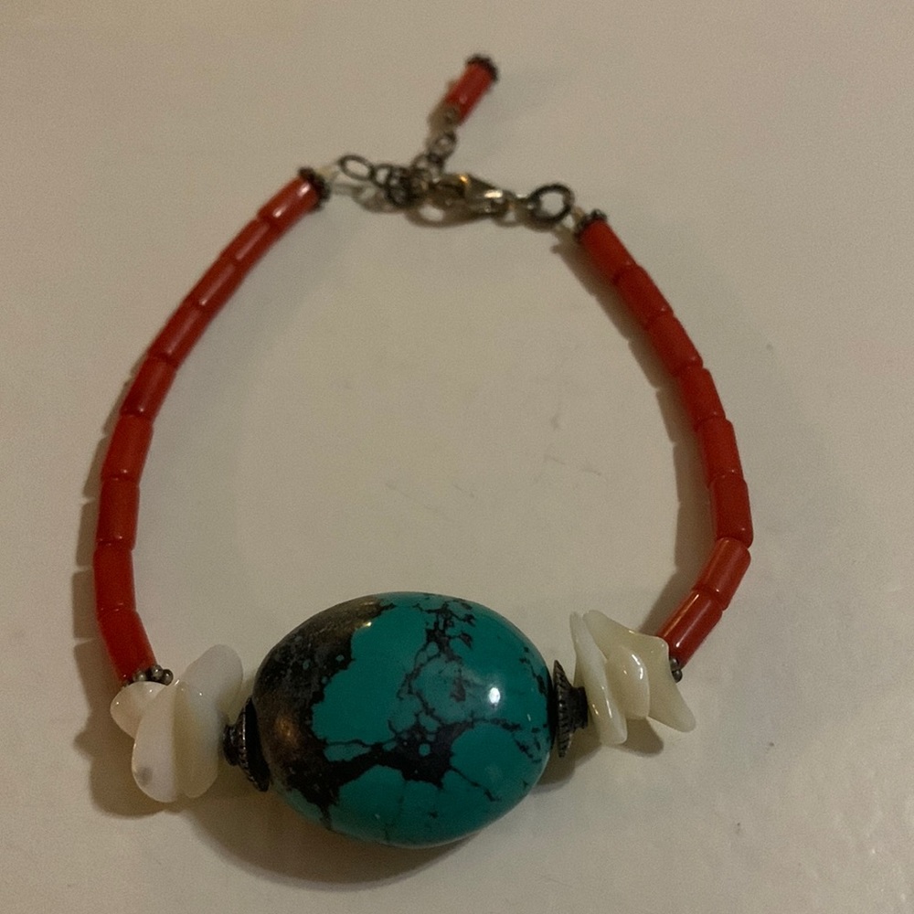 Women’s bracelet, red with turquoise stone.
